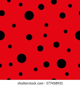 Seamless background consisting of black circles on a red background. Vector illustration