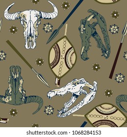 seamless background with crocodile and antelope skulls,shield, spear
