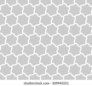 Seamless background of curved hexagons. Looks like puzzle od stars. Simple abstract pattern vector background in grey with white outline.