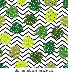 Seamless background with decorative leaves. Summer tropical design. Textile rapport.
