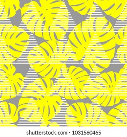 Seamless background with decorative yellow leaves. Pattern with Palm leaves. Textile rapport.