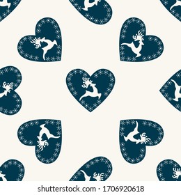Seamless background with deer and hearts. Holiday seamless pattern. Christmas and New Year seamless pattern. Cute background for textile print, wrapping paper, wall art design