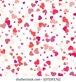 Seamless background with different colored confetti hearts for valentine time