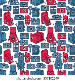 seamless background of different vintage blue and pink cameras on white background. hand-drawn illustration