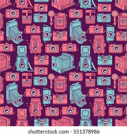 seamless background of different vintage blue and pink cameras on purple background. hand-drawn illustration