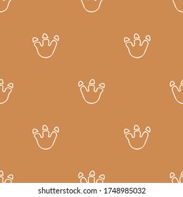 Seamless background dinosaur foot print gender neutral baby pattern. Simple whimsical minimal earthy 2 tone color. Kids nursery wallpaper or boho cartoon animal fashion all over print.