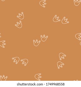 Seamless background dinosaur foot print gender neutral baby pattern. Simple whimsical minimal earthy 2 tone color. Kids nursery wallpaper or boho cartoon animal fashion all over print.