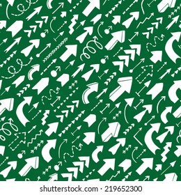 Seamless background of doodle arrows on green background. Diagonal direction of movement.