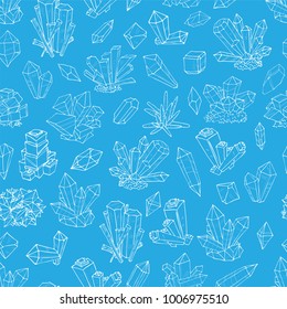 Seamless background with doodle crystals on blue background.