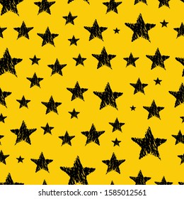 Seamless background of doodle stars. Black hand drawn stars on yellow background. Vector illustration
