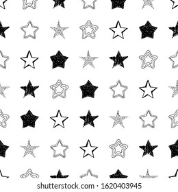 Seamless background of doodle stars. Black hand drawn stars on white background. Vector illustration