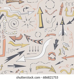 Seamless background with drawing doodles arrows on a beige background