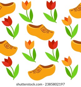 Seamless background with Dutch wooden shoe. Traditional Dutch klomp shoes and tulips.