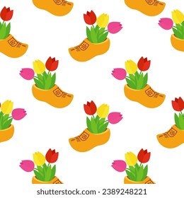 Seamless background with Dutch wooden shoe. Traditional Dutch klomp shoes and tulips.