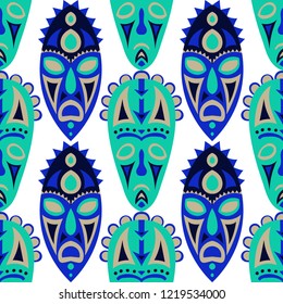 Seamless Background. Ethnic Seamless Background with Ritual Masks for Print or Card. Ethnic Seamless Pattern with Color Trible Shamanic Masks for your Design. Vector Texture.