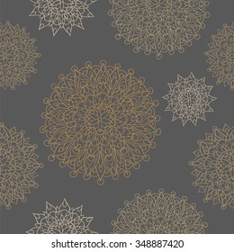 Seamless background in ethnic style with delicate mandalas