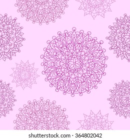 Seamless background in ethnic style with delicate mandalas