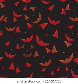 Seamless background with faces of pumpkin