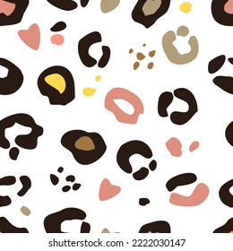 Seamless background of fashionable exotic pattern with leopard skin and spots of different colors. Artistic collage of animal drawing. template for fabric design, cover, wallpaper.