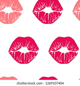 Seamless background featuring prints of red and pink lipstick on white background.
