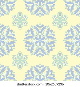 Seamless background with floral pattern. Beige background with light blue and green flower elements for wallpapers, textile and fabrics