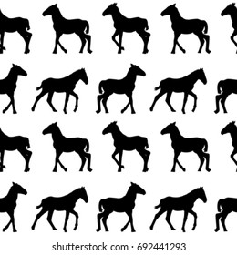 Seamless background with foals silhouettes
