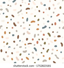 
Seamless background gender neutral baby dotted pattern. Simple whimsical minimal earthy 2 tone color. Kids nursery wallpaper or boho spotted fashion all over print.