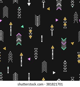 Seamless background of geometric arrow in black and gold colors.