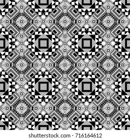 A seamless background. Graphic vector pattern. Gray, white and black texture. Abstract ornament. Wallpaper in the geometrical style.