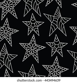 seamless background with hand drawing with white tracery of the stars in the zentangle style,drawing on a black background. vector illustration
