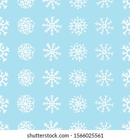 Seamless background of hand drawn snowflakes. White snowflakes on blue background. Christmas and New Year decoration elements. Vector illustration.