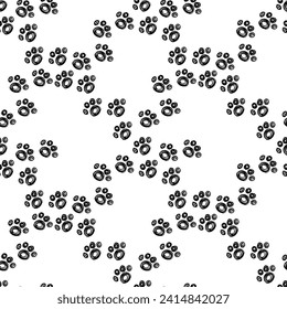 seamless background with hand-drawn footprints of cat paws. Wrapping paper, ink, backdrop, pattern.