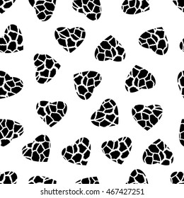Seamless background with hearts with giraffe skin pattern  