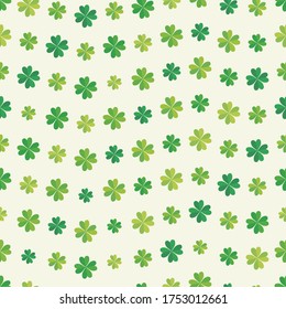 Seamless background with illustration of four-leaf clover, symbol of good luck.