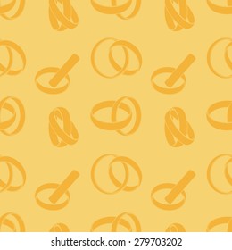 Seamless background with an image of wedding rings
