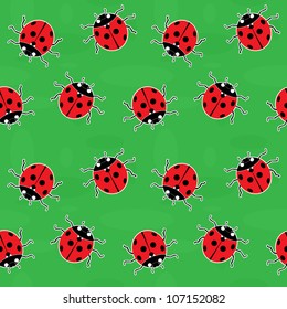 Seamless background - ladybugs on a green meadow