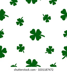 Seamless background from the leaves of the clover. St.Patrick 's Day