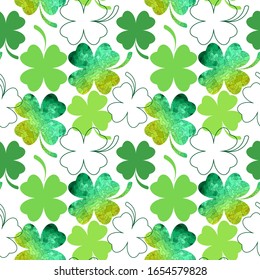 Seamless background from the leaves of the clover. St.Patrick 's Day
