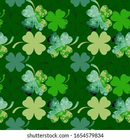 Seamless background from the leaves of the clover. St.Patrick 's Day