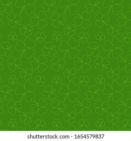 Seamless background from the leaves of the clover. St.Patrick 's Day