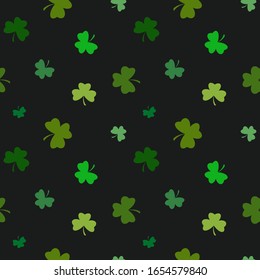 Seamless background from the leaves of the clover. St.Patrick 's Day