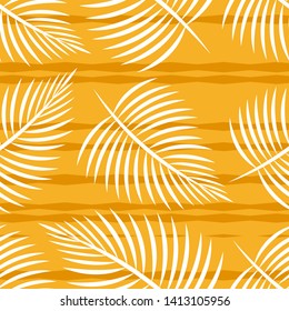 seamless background leaves of palm trees on an orange background