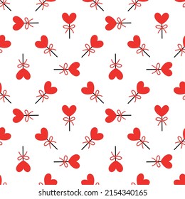 Seamless background with lollipops on a stick in the shape of a heart. pattern on valentines day. Vector illustration