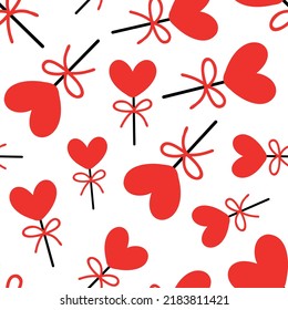 Seamless background with lollipops on a stick in the shape of a heart. pattern on valentines day. Vector illustration