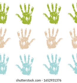 Seamless background made from color handprints.  Vector illustration. colored hand prints on white background