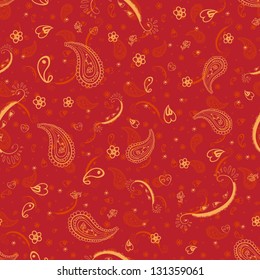 Seamless background made of paisley. Vivid red and orange.