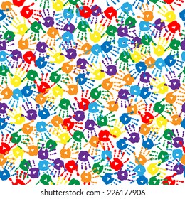 Seamless background with a multi-colored handprints