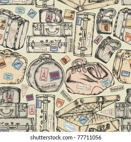 Seamless background of the old vintage suitcases