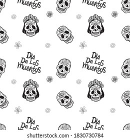 El fondo es impecable. En un fondo blanco, cráneos de diferentes géneros y con diferentes patrones. Técnica del doodle. El día de los muertos. México. Adecuado para decorar textiles, papel, papel pintado.