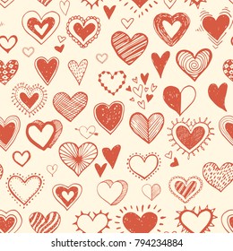 Seamless background with orange doodle sketch hearts.
